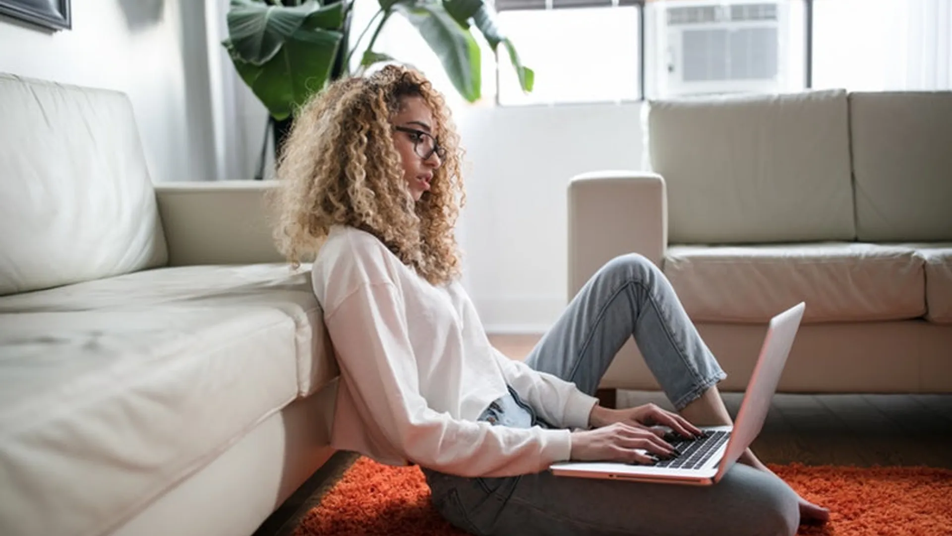 Girl sitting ground laptop